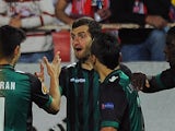 Betis' Leo Baptistao is congratulated by teammates after scoring against Sevilla during their Europa League match on March 13, 2014