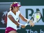 Li Na of China hits a return to Karolina Pliskova of the Czech Republic during the BNP Paribas Open at Indian Wells Tennis Garden on March 9, 2014