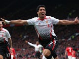 Luis Suarez of Liverpool celebrates scoring his team's third goal during the Barclays Premier League match between Manchester United and Liverpool at Old Trafford on March 16, 2014