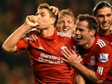 Liverpool's English midfielder Steven Gerrard celebrates scoring his second goal during the English Premier League football match between Liverpool and Everton at Anfield in Liverpool, north-west England on March 13, 2012