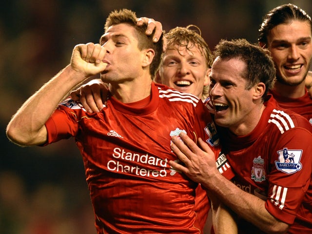 Liverpool's English midfielder Steven Gerrard celebrates scoring his second goal during the English Premier League football match between Liverpool and Everton at Anfield in Liverpool, north-west England on March 13, 2012