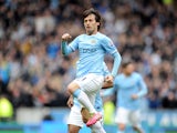 David Silva of Manchester City celebrates after he scores the first goal of the game for his side during the Barclays Premier League match between Hull City and Manchester City at the KC Stadium on March 15, 2014