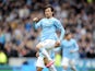 David Silva of Manchester City celebrates after he scores the first goal of the game for his side during the Barclays Premier League match between Hull City and Manchester City at the KC Stadium on March 15, 2014