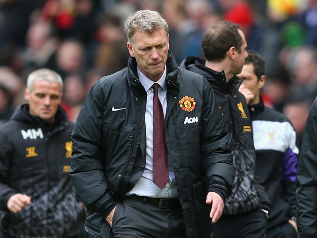 Manchester United Manager David Moyes heads for the dressing room at half-time during the Barclays Premier League match between Manchester United and Liverpool at Old Trafford on March 16, 2014