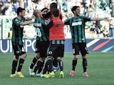 Sassuolo's Nicola Sansone is congratulated by teammates after scoring his team's third goal against Catania during the Serie A match on March 16, 2014
