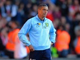 A dejected Chris Hughton manager of Norwich City looks on during the Barclays Premier League match between Southampton and Norwich City at St Mary's Stadium on March 15, 2014