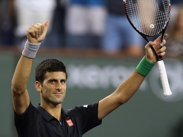 Novak Djokovic of Serbia acknowledges the fans following his victory over Victor Hanescu of Romania during the BNP Paribas Open at Indian Wells Tennis Garden on March 9, 2014