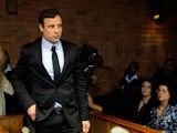 South African athlete Oscar Pistorius appears in Pretoria Magistrates Court for an indictment hearing on August 19, 2013