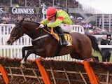 Bryan Cooper guides Our Conor over the last to victory in the JCB Triumph Hurdle at Cheltenham Racecourse on March 15, 2013