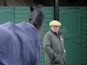 Paul Nicholls looks on as Big Buck's enters the pre parade ring at Exeter racecourse on December 19, 2013