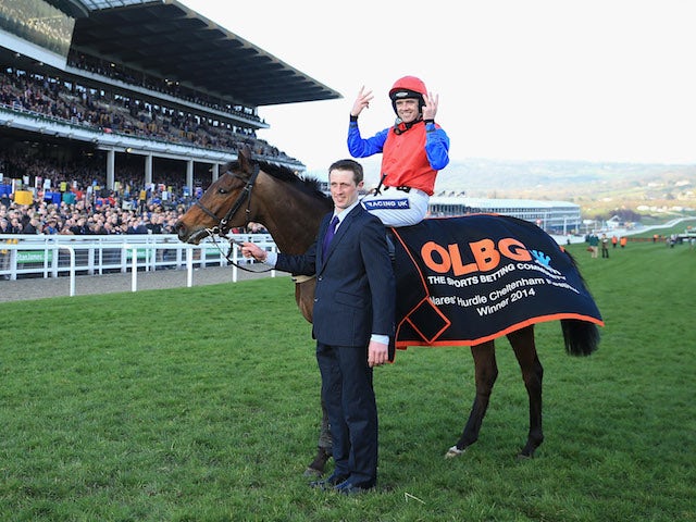 Ruby Walsh on Quevega signals the sixth successive victory for Quevega in The Olbg Mares' Hurdle Race during The Festival Champion Day at Cheltenham Racecourse on March 11, 2014