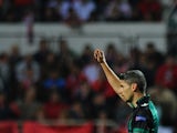 Betis' Salva Sevilla celebrates after scoring his teams second goal against Sevilla during their Europa League match on March 13, 2014