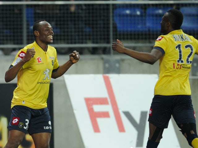 Sochaux's Zambian defender Stoppila Sunzu celebrates after scoring a goal during the French L1 football match between Sochaux (FCSM) and Lorient (FCL) on March 15, 2014