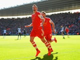 Morgan Schneiderlin of Southampton celebrates scoring the opening goal with Jay Rodriguez of Southampton during the Barclays Premier League match between Southampton and Norwich City at St Mary's Stadium on March 15, 2014