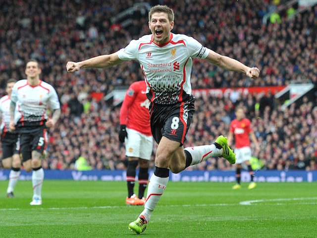 Steven Gerrard celebrates scoring his and Liverpool's second goal against Manchester United in the Premier League at Old Trafford on March 16, 2014