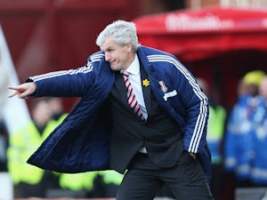 Mark Hughes manager of Stoke City gives instructions during the Barclays Premier League match between Stoke City and West Ham United at Britannia Stadium on March 15, 2014