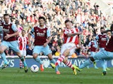Marko Arnautovic of Stoke City beats Kevin Nolan, James Tomkins and Guy Demel of West Ham United to score their second goal during the Barclays Premier League match between Stoke City and West Ham United at Britannia Stadium on March 15, 2014