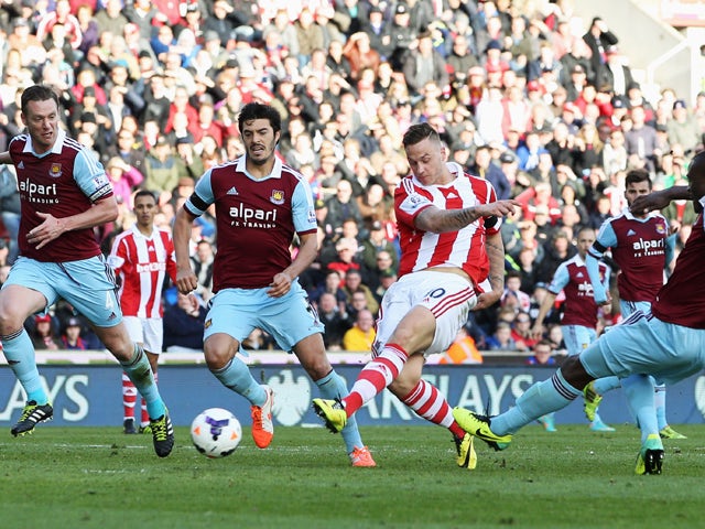 Marko Arnautovic of Stoke City beats Kevin Nolan, James Tomkins and Guy Demel of West Ham United to score their second goal during the Barclays Premier League match between Stoke City and West Ham United at Britannia Stadium on March 15, 2014