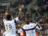 Toulouse's French defender Serge Aurier celebrates with teammate after scoring a goal during the French L1 football match Rennes (SRFC ) vs Toulouse (TFC) at the Route de Lorient stadium in Rennes, western France, on March 15, 2014