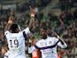 Toulouse's French defender Serge Aurier celebrates with teammate after scoring a goal during the French L1 football match Rennes (SRFC ) vs Toulouse (TFC) at the Route de Lorient stadium in Rennes, western France, on March 15, 2014