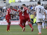 Stephane Sessegnon of West Bromwich Albion celebrates his goal with Youssouf Mulumbi (left) and Liam Ridgewell during the Barclays Premier League match between Swansea City and West Bromwich Albion at The Liberty Stadium on March 15, 2014