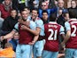 Andy Carroll of West Ham United celebrates with team mates as he scores their first goal during the Barclays Premier League match between Stoke City and West Ham United at Britannia Stadium on March 15, 2014