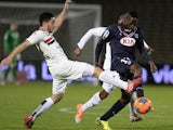 Bordeaux midfielder Andre Poko vies with Nice's forward Neal Maupay during the French L1 football match Bordeaux vs Nice, on March 22, 2014 