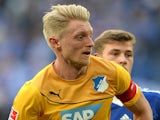 Hoffenheim's defender Andreas Beck (L) vies for the ball during the German first division Bundesliga football match against FC Schalke 04 on March 8, 2014