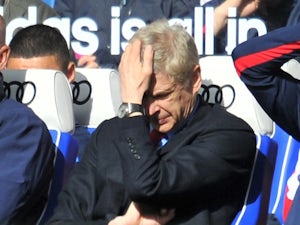 Wenger pessimistic over UCL place