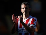 Kevin O'Connor of Brentford claps towards the travelling fans after the Sky Bet League One match between Bradford City and Brentford at the Coral Windows Stadium on September 7, 2013