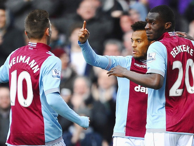 Christian Benteke of Aston Villa celebrates with teammates after scoring the opening goal during the Barclays Premier League match against Stoke City on March 23, 2014