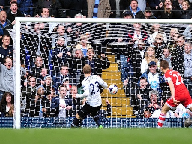 Tottenham Hotspur's Danish midfielder Christian Eriksen (L) scores his team's second goal during the English Premier League football match against Southampton on March 23, 2014