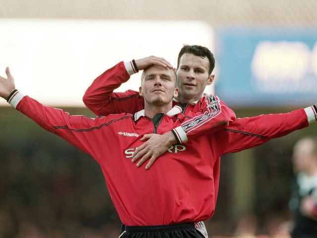 Ryan Giggs and David Beckham celebrate the latter's goal for Manchester United against Leicester City on March 18, 2000.