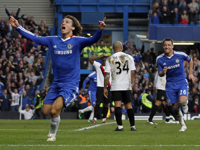 Chelsea's Brazilian player David Luiz (L) celebrates scoring his goal against Manchester City during a Premier League football match at Stamford Bridge in London, England on March 20, 2011