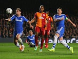 John Terry of Chelsea (R) misses a chance as Branislav Ivanovic of Chelsea (L) and Didier Drogba of Galatasaray (C) look on during the UEFA Champions League Round match on March 18, 2014
