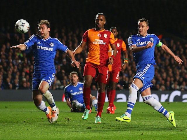 John Terry of Chelsea (R) misses a chance as Branislav Ivanovic of Chelsea (L) and Didier Drogba of Galatasaray (C) look on during the UEFA Champions League Round match on March 18, 2014