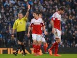 Referee Jonathan Moss shows Fernando Amorebieta of Fulham a red card during the Barclays Premier League match against Manchester City on March 22, 2014