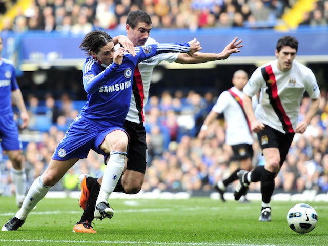 Chelsea's Spanish striker Fernando Torres (L) vies with Manchester City's Serbian defender Aleksandar Kolarov (R) during their English Premier League football match on March 20, 2011