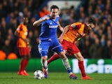 Frank Lampard of Chelsea evades Selcuk Inan of Galatasaray during the UEFA Champions League Round of 16 second leg match on March 18, 2014