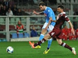 Gonzalo Higuain (L) of SSC Napoli scores the opening goal during the Serie A match between Torino FC and SSC Napoli at Stadio Olimpico di Torino on March 17, 2014 