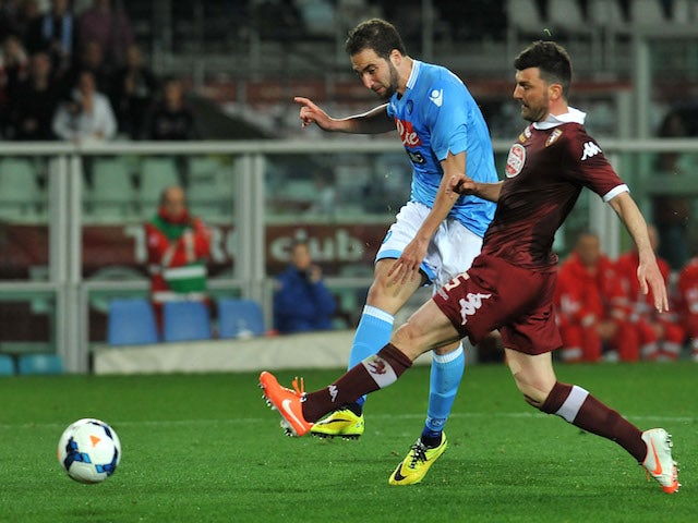 Gonzalo Higuain (L) of SSC Napoli scores the opening goal during the Serie A match between Torino FC and SSC Napoli at Stadio Olimpico di Torino on March 17, 2014 