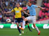 Ian Miller of Cambridge United battles with Justin Bennett of Gosport Borough during the FA Carlsberg Trophy Final 2014 at Wembley Stadium on March 23, 2014