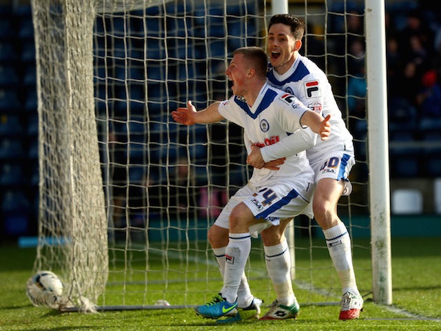 Jamie Allen (L) of Rochdale celebrates with Ian Henderson (R) after scoring the opening goal during the SkyBet League Two match against Wycombe Wanderers on March 22, 2014