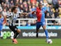 Jason Puncheon of Crystal Palace takes on Fabrizio Coloccini of Newcastle United during the Barclays Premier League match on March 22, 2014
