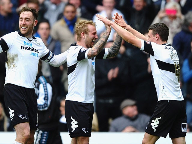 Derby's Johnny Russell celebrates after scoring his team's fourth goal against Nottingham Forest during the Championship match on March 22, 2014
