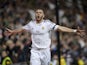 Real's Karim Benzema celebrates after scoring his team's second goal against Barcelona in the La Liga match on March 23, 2014