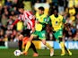 Ki Sung-Yong of Sunderland is challenged by Wesley Hoolahan of Norwich City during the Barclays Premier League match on March 22, 2014