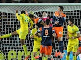 Nantes' French defender Koffi Djidji (L) scores a goal during the French L1 football match between Nantes and Montpellier on March 22, 2014