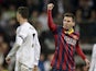 Barcelona'sLionel Messi celebrates after scoring his team's second goal against Real Madrid in the La Liga match on March 23, 2014