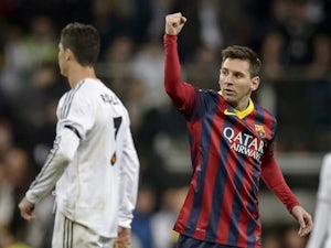 Messi hat-trick downs Madrid